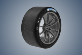 Michelin Pilot Sport GT tire with 19“wheel standing up, surrounded by gray-blue vignette
